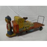 A large tin plate O gauge clockwork luggage trolley with bell