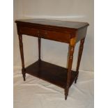 An Edwardian walnut rectangular side table with a single drawer in the frieze on turned supports