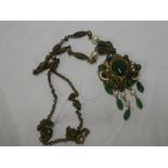 An unusual jade and pearl mounted gilt pendant necklace with chain