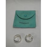 A pair of Tiffany silver circlet earrings in Tiffany slip