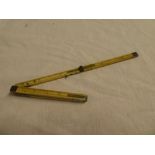 A 19th Century brass mounted ivory 12" folding pocket ruler