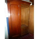 A Victorian stained pine wardrobe with two internal drawers,