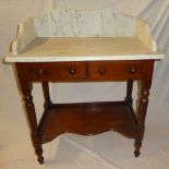 A small Victorian mahogany wash stand with two drawers in the frieze above an open shelf below