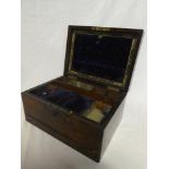 A Victorian inlaid rosewood work box with fitted interior and sprung base drawer