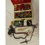 A jewellery box containing a quantity of various costume jewellery