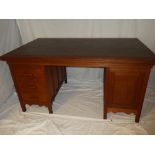 A 1930's mahogany partner-style pedestal desk,