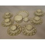 A Victorian china tea set with floral decoration comprising six tea cups, six saucers,