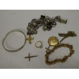 A selection of various costume jewellery including two crucifix pendants, silver charm bracelet,