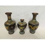 A pair of Japanese cloisonne enamelled baluster-shaped vases with dragon decoration,