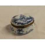 An early 19th Century Continental porcelain table box with blue and white female figure and