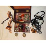 A jewellery box containing a quantity of various costume jewellery