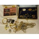 Two boxes containing a quantity of various costume jewellery including two pairs of 9ct gold