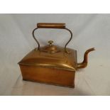 A large Victorian copper rectangular kettle with scroll handle