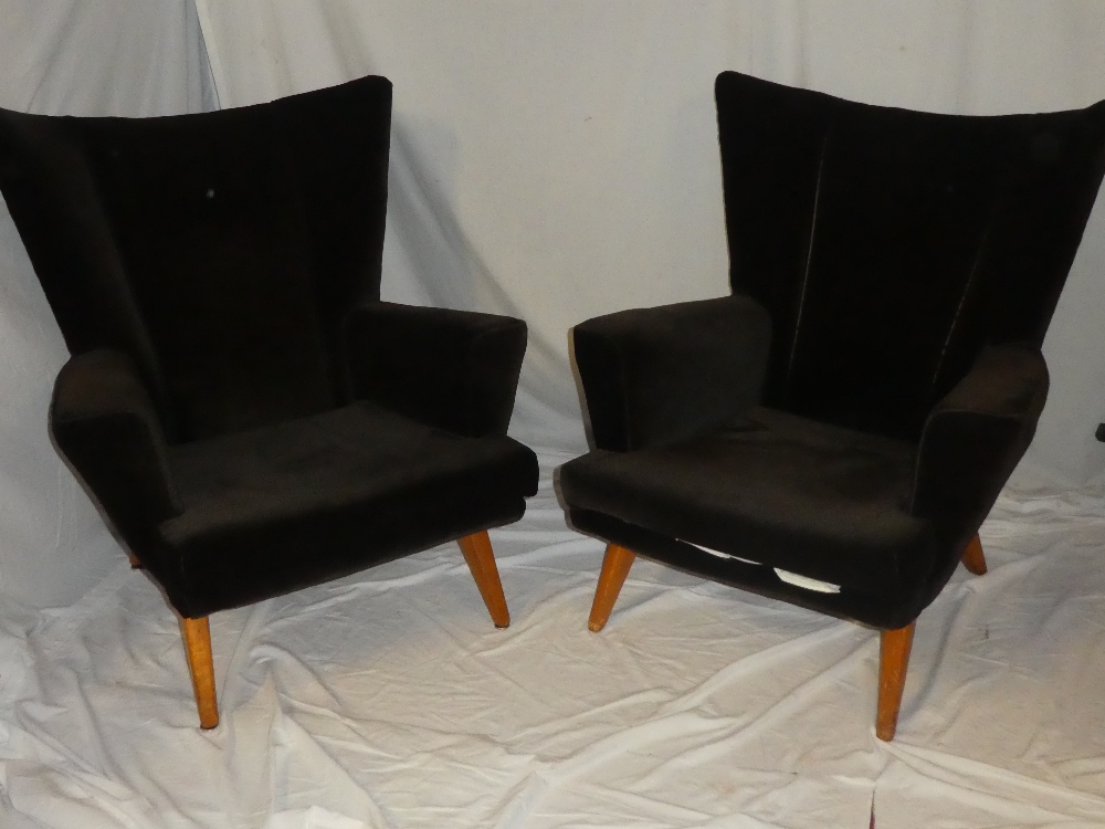 A pair of 1950's/60's G-plan wing easy chairs upholstered in brown draylon