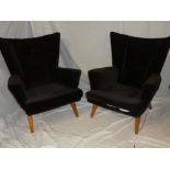 A pair of 1950's/60's G-plan wing easy chairs upholstered in brown draylon