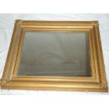 An old rectangular wall mirror in ornate gilt frame,
