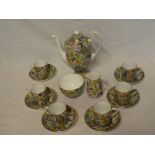 A Grosvenor china coffee set with floral and leaf decoration comprising coffee pot, milk jug,