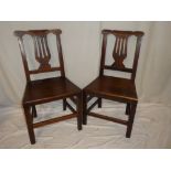 A late 18th/early 19th Century set of six oak and elm Country-style dining chairs with pierced vase