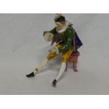 A 19th Century Derby porcelain figure of a classical seated male,