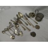 A selection of Continental silver table cutlery, condiment cutlery, cup holder,