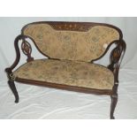 A late Victorian inlaid mahogany two seat settee with marquetry inlaid panels,