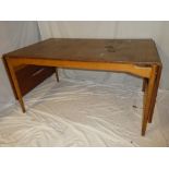 A 1960's Swedish teak drop leaf dining table in the style of Hans Wegner,