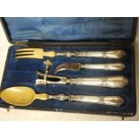 A Continental four-piece serving set with electro-plated mounts comprising joint holder,