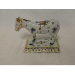 A French Quimper pottery figure of a horse on rectangular base (af)