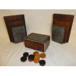 A 19th Century inlaid mahogany games box with mosaic top containing a selection of draught counters