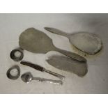 A silver mounted three-piece part dressing set (af); two various silver napkin rings,
