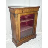 A Victorian brass mounted walnut rectangular display cabinet with fabric lined shelves enclosed by