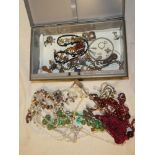 A tin containing a selection of mixed costume jewellery and other jewellery etc