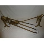 A brass companion set comprising tongs,