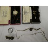 A ladies 9ct gold wristwatch with circular dial and cord strap,