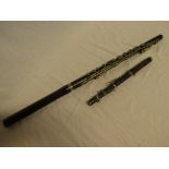 A nickel mounted rosewood three-piece flute and a rosewood piccolo (2)