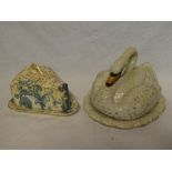A Victorian Staffordshire pottery cheese dish and cover in the form of a swan on a lily pad and one