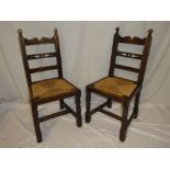 A set of eight 19th Century Continental oak Country-style dining chairs with rail backs and string