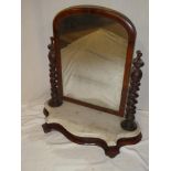 A Victorian mahogany arched toilet mirror on spiral turned supports with marble mounted serpentine