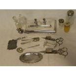 A selection of various silver-plated items including desk stand, knife rests, wick scissors,