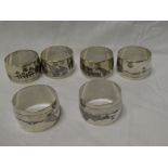 A set of six Eastern silvered circular napkin rings with niello Nile scene decoration