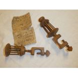 Two old wooden cotton winders with clamp bases,