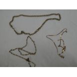 A 9ct gold pocket watch chain and two other 9ct gold fine link necklaces (3)
