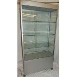 A good quality modern aluminium glazed rectangular free-standing display cabinet with sliding doors