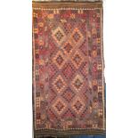 An Eastern flat-weave rectangular rug with geometric decoration on red and brown ground 8'6" x 4'6"