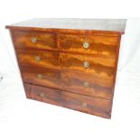A Victorian figured mahogany chest of two short and three long drawers with brass ring handles