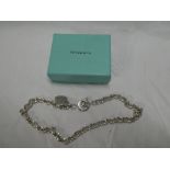 A Tiffany heavy silver chain-link necklace with heart emblem in Tiffany box