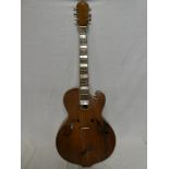 An old six string guitar with 19" back in fitted fibre case