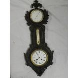 An unusual wall-mounted clock and barometer set by J J Wainwright of Birmingham with circular dials