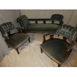 A Victorian mahogany parlour suite comprising a chaise longe upholstered in blue buttoned fabric