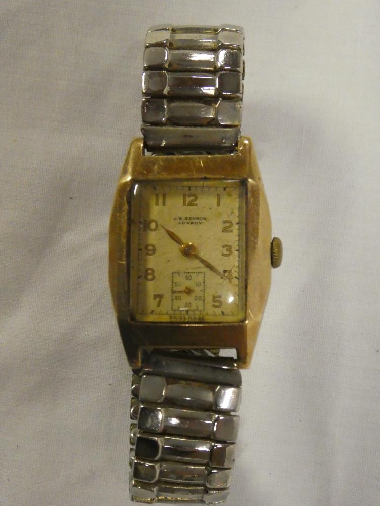 A gentleman's 9ct gold wrist watch by JW Benson of London with rectangular dial and expanding strap